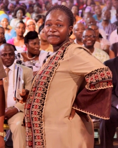 Mrs Stanley Igwe joyfully testifying to the congregation.